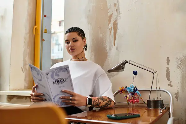 In a lively cafe, a young woman with unique style studies the menu, savoring her time alone. — Stock Photo