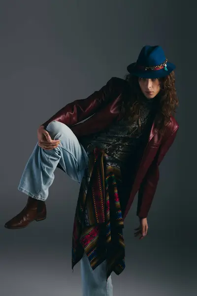 Handsome and fashionable individual poses confidently in a trendy outfit inside a sleek studio. — Stock Photo