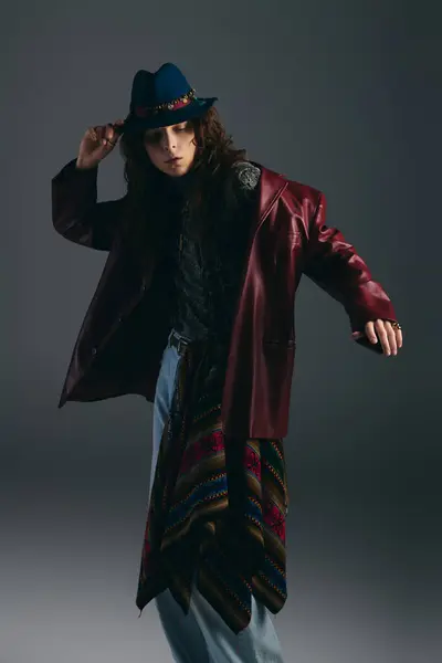Handsome man showcases trendy attire while striking a confident pose against a neutral backdrop. — Stock Photo