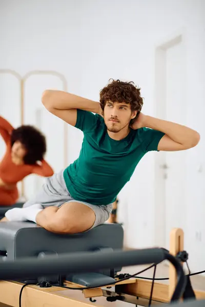 Committed individuals build strength and flexibility while enjoying a calm workout. — Stock Photo