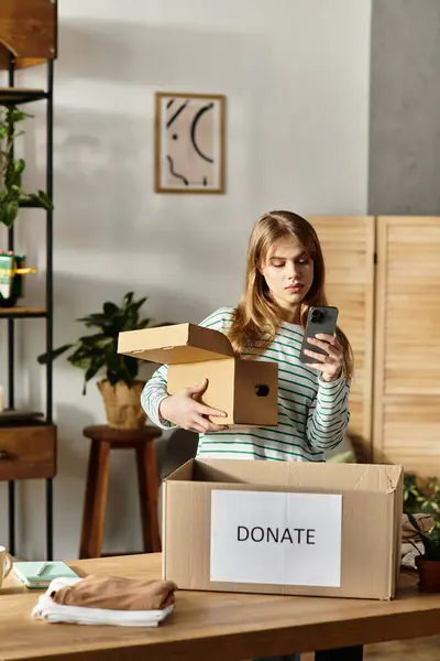 Young woman organizes her clothes for donation, promoting a greener lifestyle and decluttering. — Stock Photo