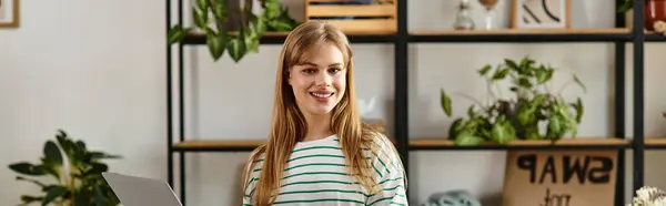 Young woman joyfully sorts through clothes, preparing donations for sustainable living, banner — Stock Photo