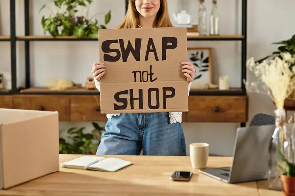 Young woman sorts through clothes while advocating for a sustainable lifestyle at home — Stock Photo
