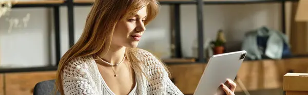 A young woman is focused on donating clothes through tablet, promoting a sustainable lifestyle, banner — Stock Photo