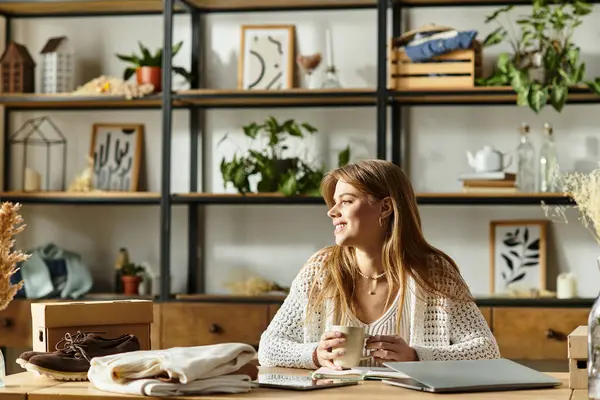 A young woman sorts her clothes for donation, promoting a sustainable lifestyle with joy. — Stock Photo
