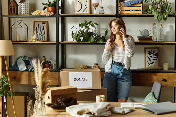 A pretty young woman sorts clothes to donate while embracing a sustainable lifestyle at home. — Stock Photo