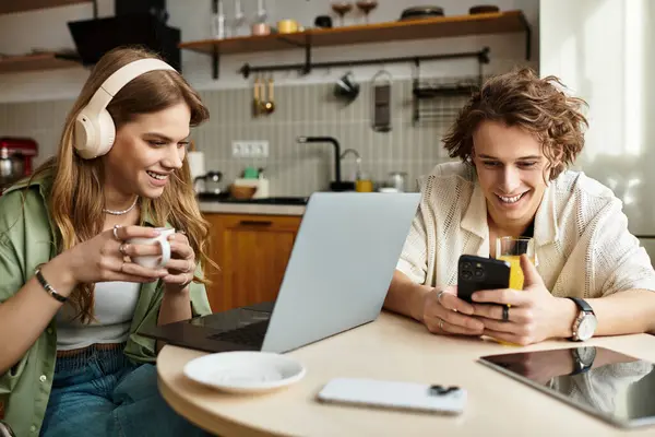 A loving couple relaxes at home, enjoying their own activities together. — Stock Photo