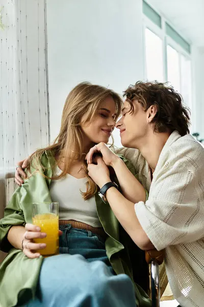 A loving couple enjoys an intimate moment at home, surrounded by warmth and comfort. — Stock Photo
