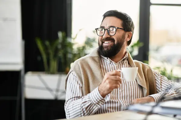 A cheerful senior man relaxes in a bright cafe, sipping coffee and savoring the moment — Stock Photo