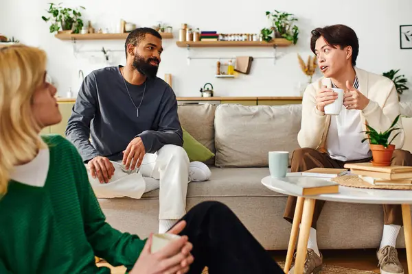 Young men share insights at a lively book club meeting at home, building friendship. — Stock Photo