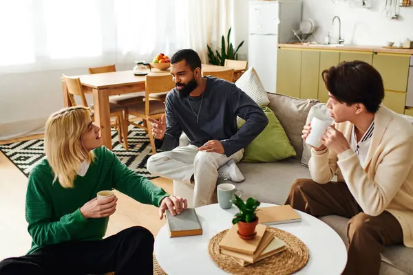 Young and handsome men enjoy a lively conversation during a book club meeting at home. — Stock Photo