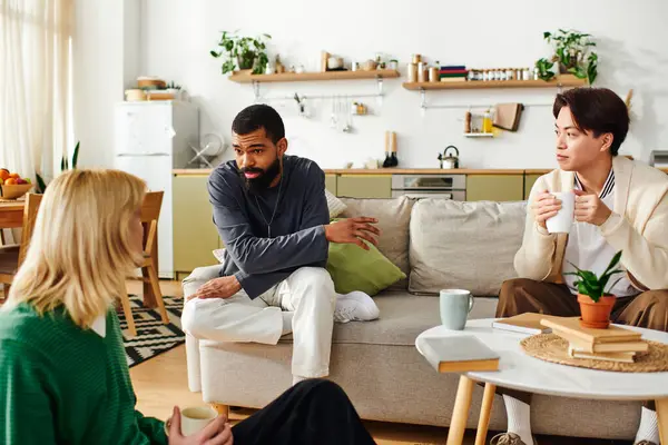 Young diverse men share lively discussions while enjoying a cozy reading club gathering at home. — Stock Photo