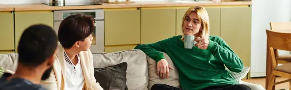 Young diverse men connect over thoughtful conversations in a stylish, casual setting at home. — Stock Photo
