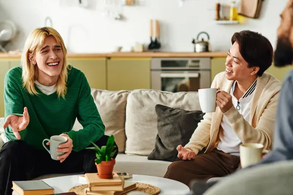 Young men share laughter and ideas during a lively discussion in a stylish and relaxed setting. — Stock Photo
