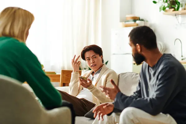 Handsome young men share lively conversations in a modern book club setting at home. — Stock Photo