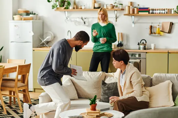 Three young men gather to share thoughts and ideas in a relaxed home atmosphere. — Stock Photo