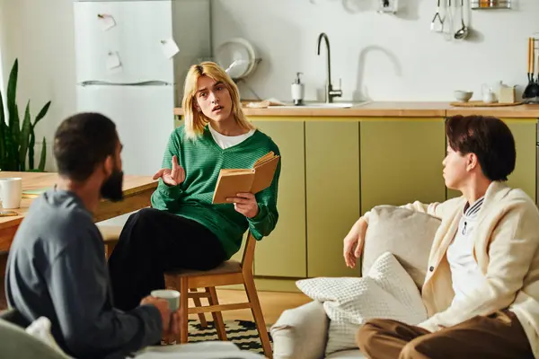 Three diverse young men share ideas and insights during a relaxed book club meeting at home. — Stock Photo