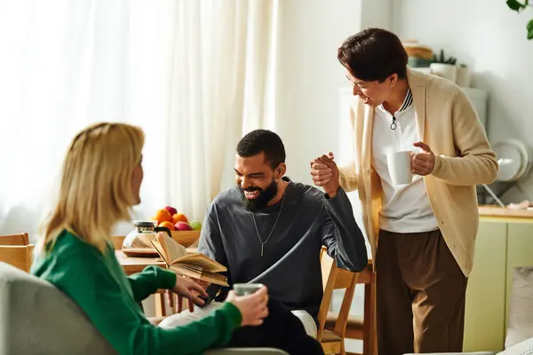 Friends share ideas and laughter while reading together in a stylish and comfortable home setting. — Stock Photo