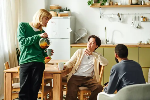 A diverse group of young men chats happily over coffee in a stylish home setting. — Stock Photo
