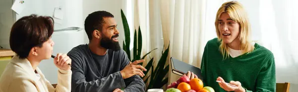 Young diverse men gather at home for a lively book discussion and bonding moment. — Stock Photo