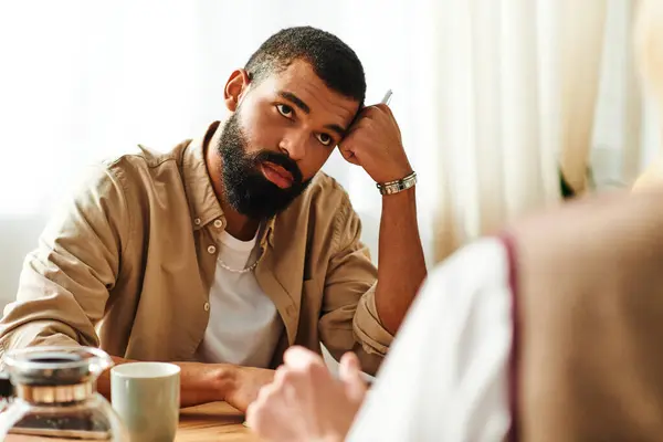 Young men gather in a stylish home, sharing thoughts and ideas during their reading club meeting. — Stock Photo
