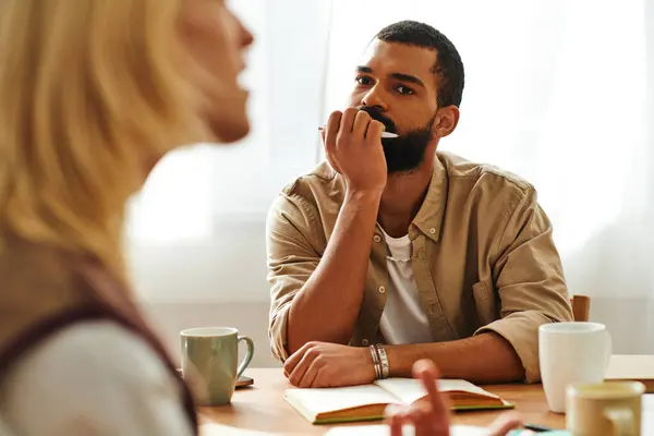 Young men share insights at a home book club, deepening their friendship. — Stock Photo