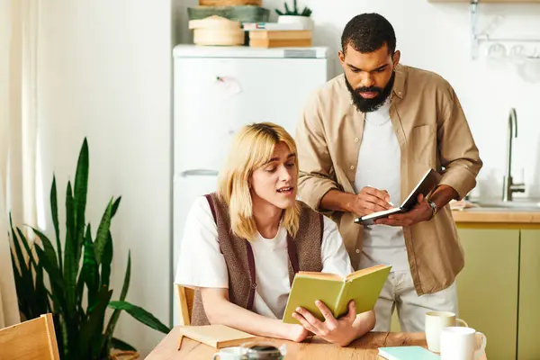 Diverse group of young men sharing thoughts and ideas during a casual reading session at home. — Stock Photo
