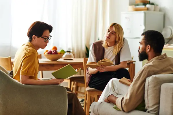 Three handsome young men share ideas and insights while reading together in a relaxed environment. — Stock Photo