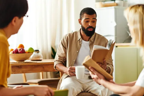 A group of diverse young men share insights during a relaxed book club meeting at home. — Stock Photo