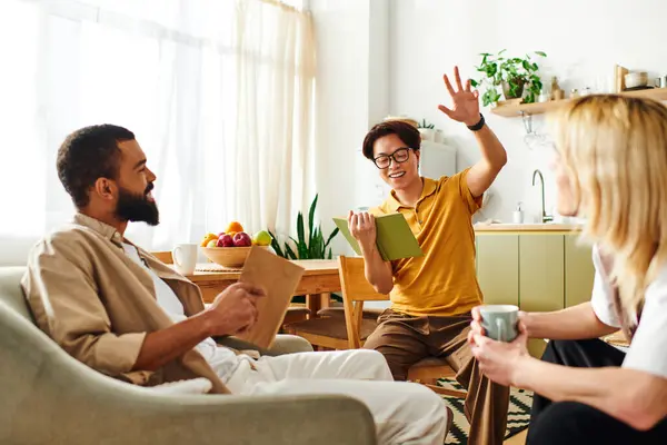 Young men share ideas and laughter at their casual home book club, creating a warm atmosphere. — Stock Photo
