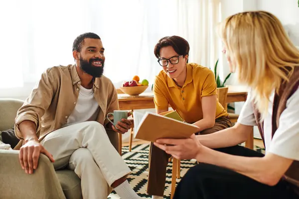Three diverse young men enjoy lively discussions and share insights in a warm, inviting atmosphere. — Stock Photo