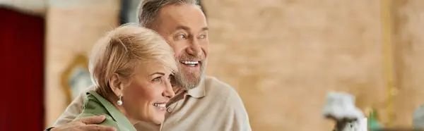 A middle aged couple shares laughter and joy during their romantic date, banner — Stock Photo