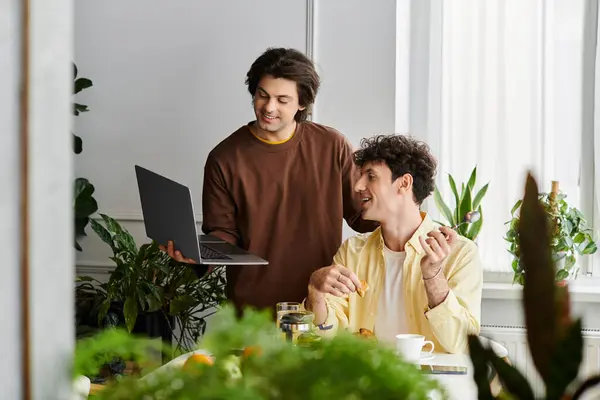 Two men enjoy each others company while engaging in a delightful conversation at home. — Stock Photo