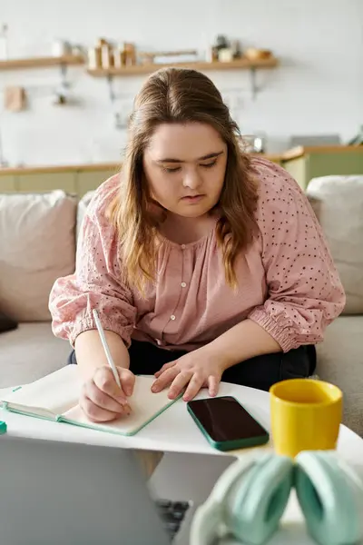 Engaging in creative activities, the young woman exudes confidence and warmth at home. — Stock Photo