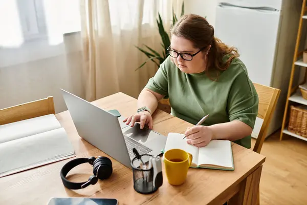 A bright room where a young woman with Down syndrome studies, highlighting her talents. — Stock Photo
