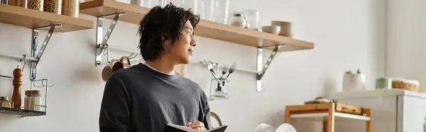 Handsome young man engages in online learning at home, balancing study and leisure with ease, banner — Stock Photo