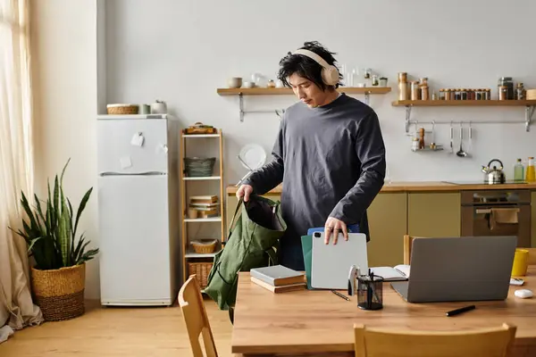 Handsome young asian student prepares to study online in a comfortable home environment. — Stock Photo