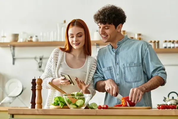 A couple shares quality time cooking together, filled with fresh ingredients and laughter. — Stock Photo