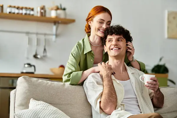 Couple shares a joyful moment at home, filled with laughter as they enjoy each others company. — Stock Photo