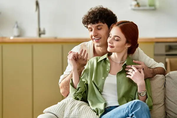 A couple delights in each others company at home, wrapped in love while sharing tender moments. — Stock Photo