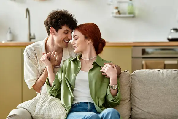 Young couple shares affectionate moments while enjoying time together in their cozy home. — Stock Photo