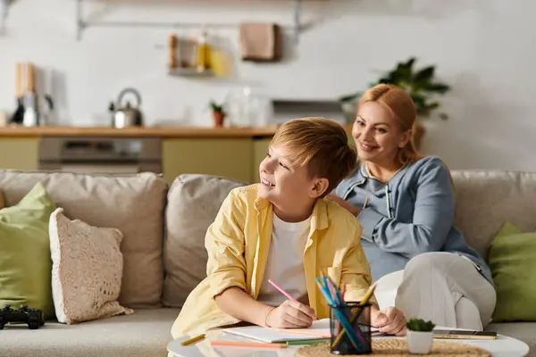 A mother and her son enjoy quality time together as they engage in creative activities at home. — Stock Photo