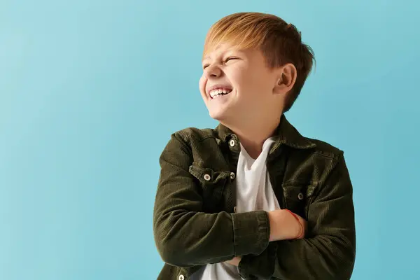 A little adorable boy in comfy attire posing cheerfully on vivid backdrop. — Stock Photo