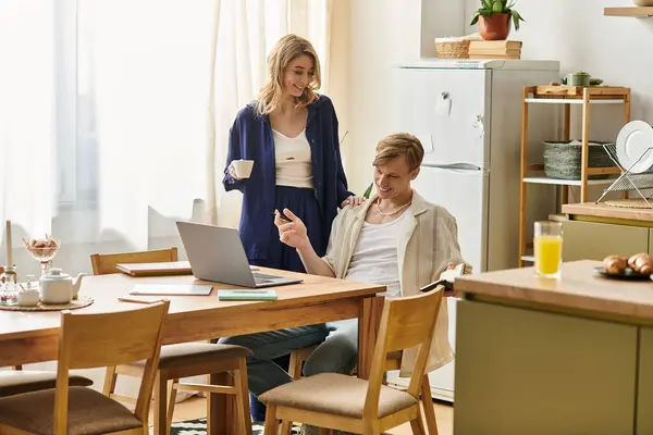 In a cozy, sunlit home, a couple shares a romantic moment, filled with joy and connection. — Stock Photo