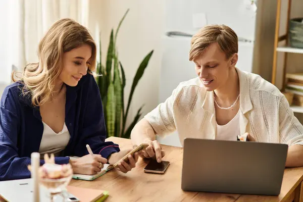 Young couple shares a warm, intimate moment at home, engaged in creative pursuits and laughter. — Stock Photo