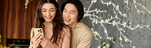 Joyful couple laughs together while preparing for their wedding in a cozy atmosphere. — Stock Photo