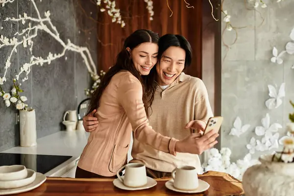 A happy couple enjoys a moment as they prepare for their wedding, surrounded by floral decorations. — Stock Photo