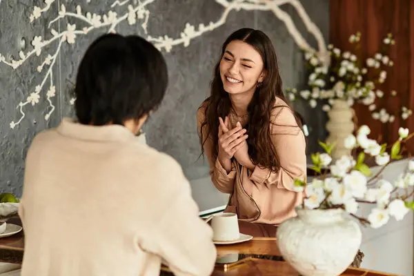 A couple joyfully plans their wedding, sharing smiles and love in a cozy atmosphere. — Stock Photo