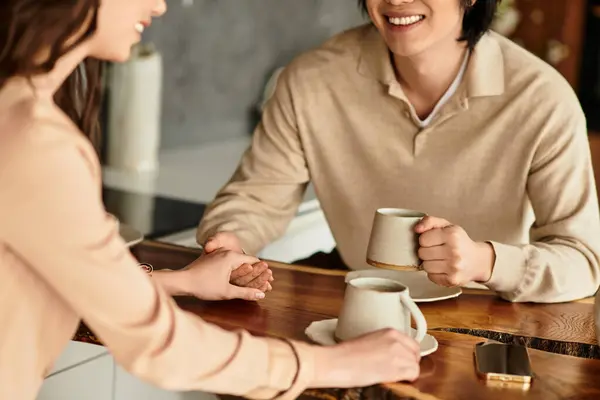 Lively couple enjoying each others company while planning their upcoming wedding at home — Stock Photo