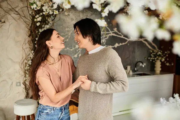 Lovers share joyful moments as they prepare for their special wedding day in a floral paradise. — Stock Photo